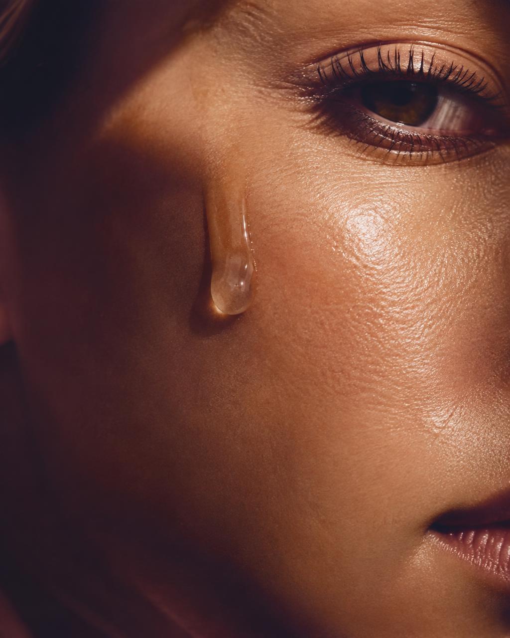 Macro of dewy skin with a drop of serum